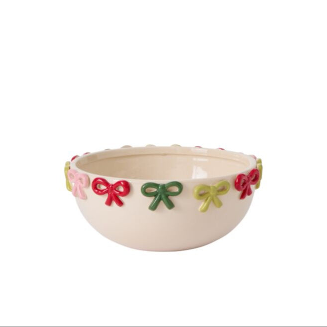 Decorative bowl with colorful bow designs on a white background